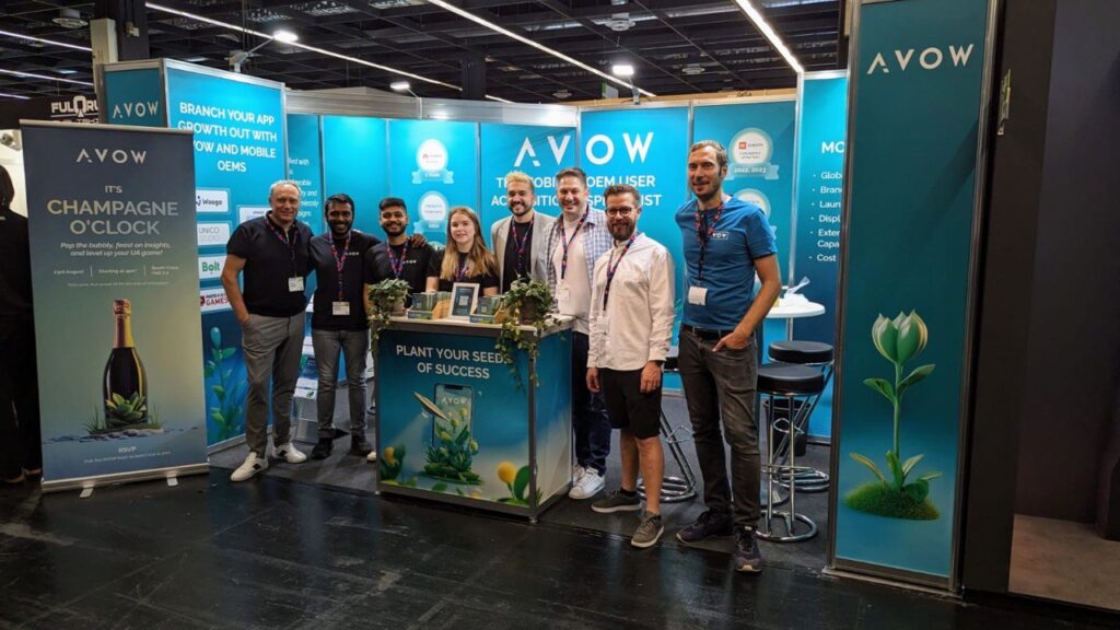 AVOW team at event booth during a mobile marketing conference, with Natalie Karakina leading field marketing to showcase app growth, user acquisition, and mobile OEM advertising strategies.
